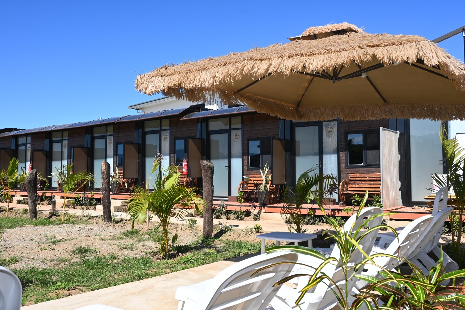 Garden and cabin-style Nest rooms beneath the Sabeto Mountains under a soft Fijian dawn